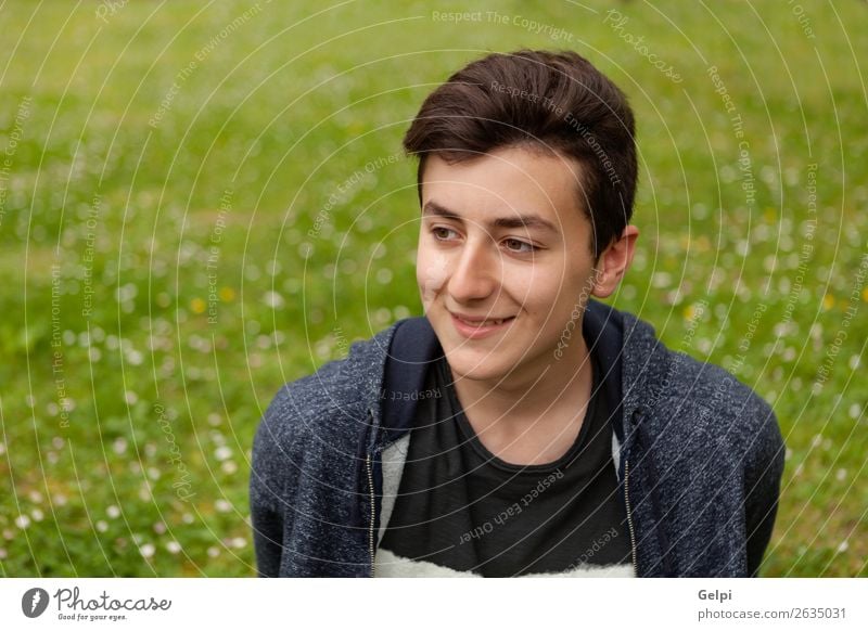 Attractive teenager guy in a park Lifestyle Style Happy Beautiful Hair and hairstyles Face Summer Human being Boy (child) Man Adults Youth (Young adults) Nature