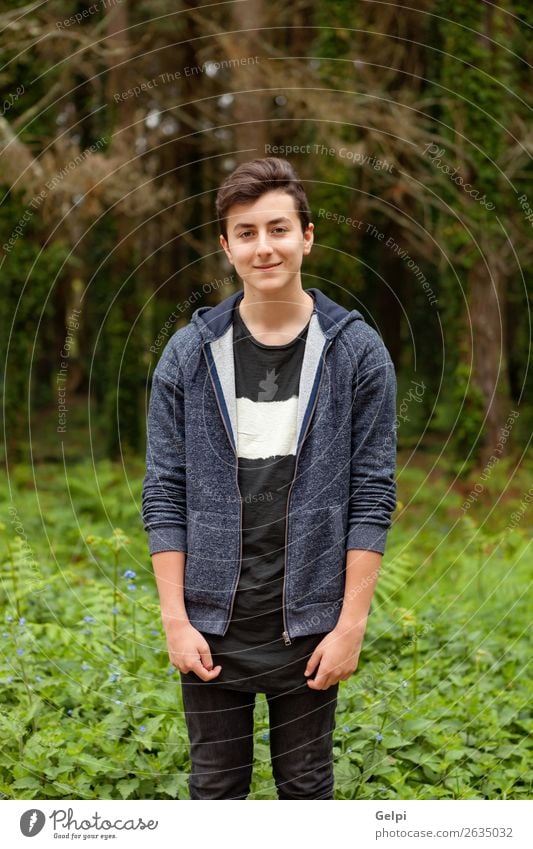 Attractive teenager guy in a park Lifestyle Style Happy Beautiful Hair and hairstyles Face Summer Human being Boy (child) Man Adults Youth (Young adults) Nature