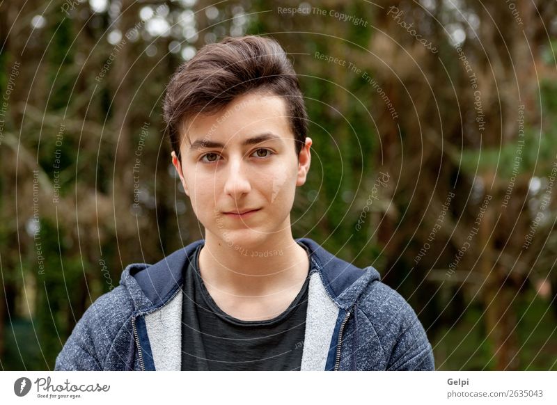 Attractive teenager guy in a park Lifestyle Style Happy Beautiful Hair and hairstyles Face Summer Human being Boy (child) Man Adults Youth (Young adults) Nature