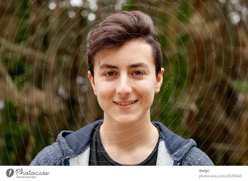 Attractive teenager guy in a park Lifestyle Style Happy Beautiful Hair and hairstyles Face Summer Human being Boy (child) Man Adults Youth (Young adults) Nature