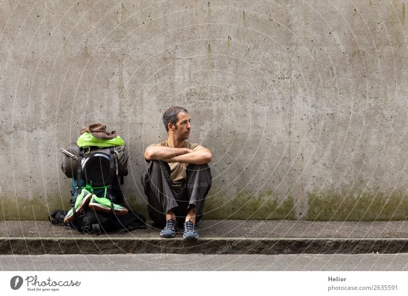 Backpacker takes a break from travelling by hitchhiker Lifestyle Vacation & Travel Trip Adventure Far-off places Freedom Human being Man Adults 30 - 45 years