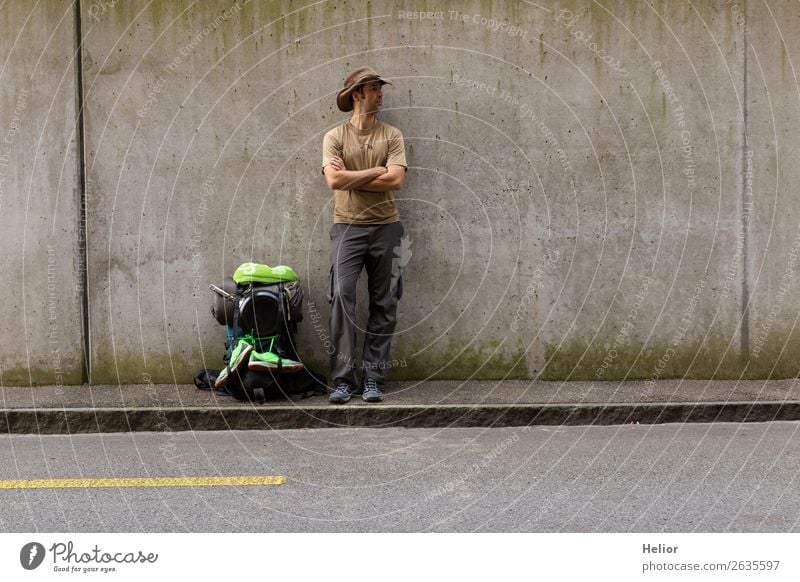 Backpacker takes a break from travelling by hitchhiker Lifestyle Vacation & Travel Tourism Trip Adventure Far-off places Freedom Human being Man Adults