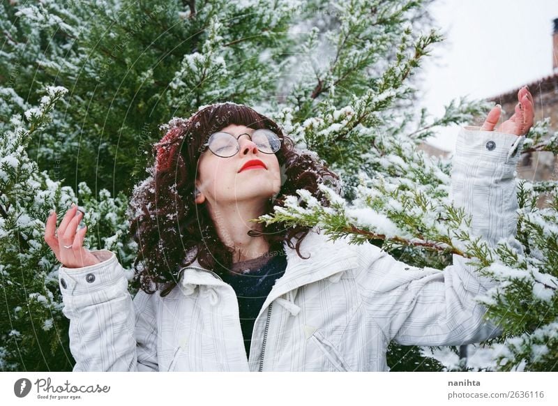 Young woman enjoying a snowy winter day Lifestyle Style Happy Adventure Freedom Winter Snow Christmas & Advent New Year's Eve Human being Feminine