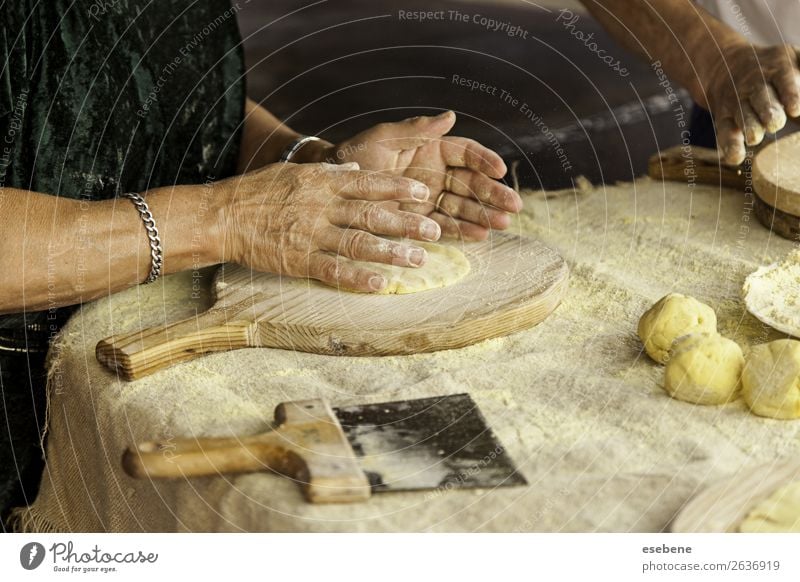 Kneading dough in a traditional bakery Dough Baked goods Bread Eating Table Kitchen Restaurant Work and employment Human being Woman Adults Man Hand Wood Make