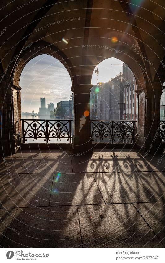 View through the Oberbaumbrücke in the backlight metropolis Freedom City Berlin center Panorama (View) Sunbeam urban Beautiful weather City life Sunlight Light