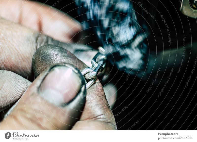 Jeweler working on silver chain in his workshop. Profession Factory Craft (trade) Fingers Plant Jewellery Ring File Metal Dark Red gold Self-made Professional