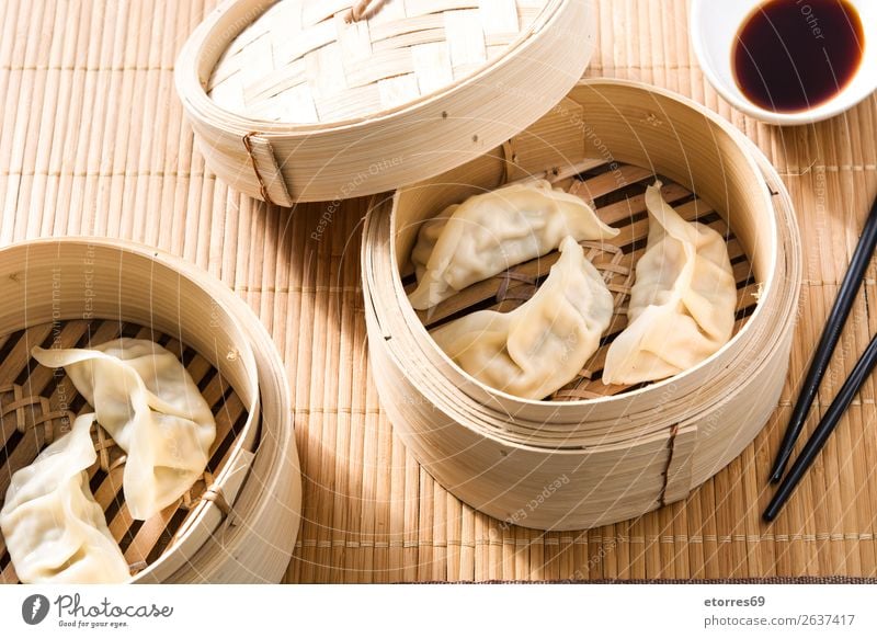 Dumplings or gyoza served in traditional steamer Japanese Chinese Oriental Food Healthy Eating Food photograph Tradition Soja-bean sprout Soy bean Meal Asia