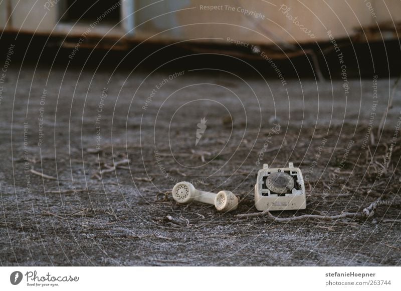 scars on land Telephone Shabby Receiver Colour photo Exterior shot Copy Space left Shallow depth of field Broken Defective Lie Old Deserted 1 Ground Gray