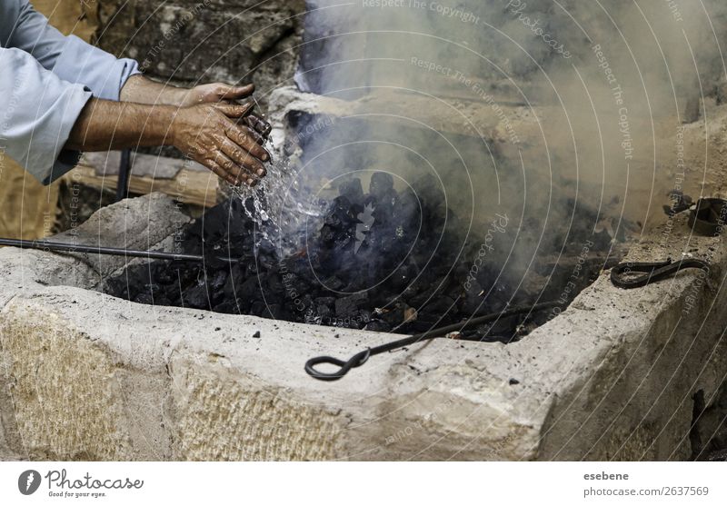 Turning off flames with water in the coal Lunch Beautiful Work and employment Hand Old Fresh Hot Natural Black White Protection Colour Testing & Control