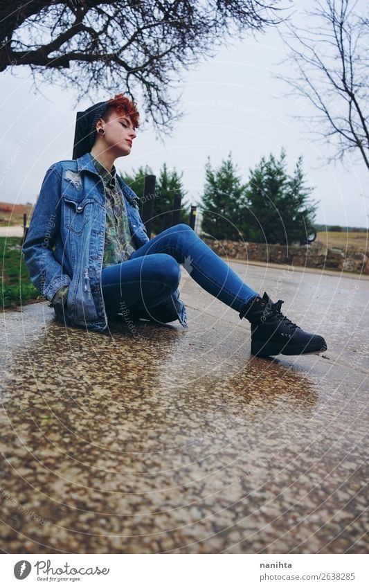 Young redhead woman alone in a village in a rainy day Lifestyle Style Freedom Winter Human being Feminine Androgynous Young woman Youth (Young adults) Woman