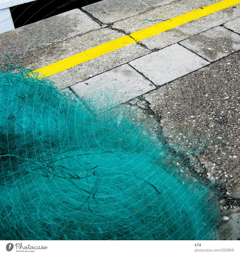 fishing net Harbour Stone Concrete Lie Yellow Green Fishery Fishing net Marker line Asphalt Crack & Rip & Tear Colour photo Multicoloured Exterior shot Deserted