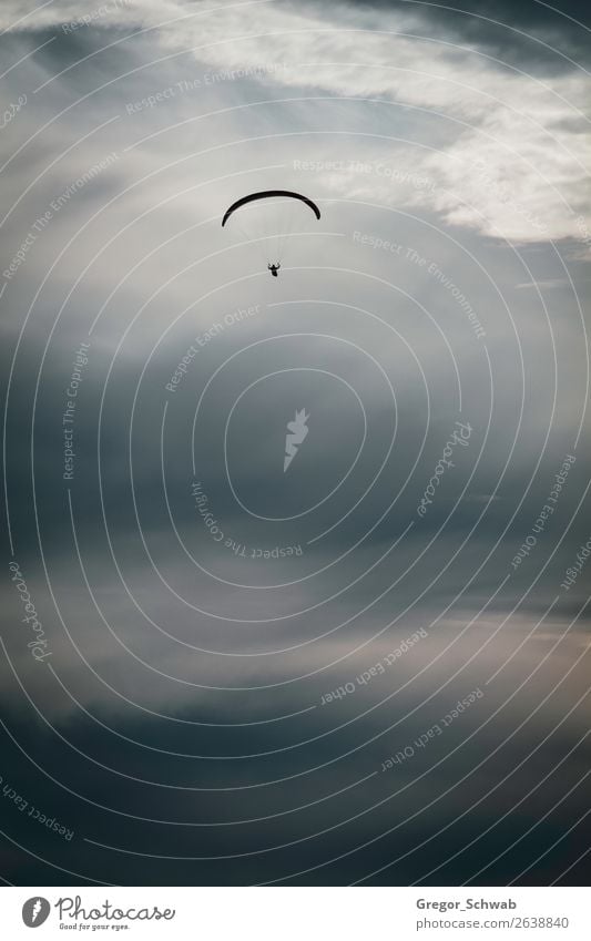 Lonely flight Storm Brave Safety Safety (feeling of) Paragliding Paraglider Clouds Sunset Dramatic art Freedom Flying Rhoen Wasserkuppe Exterior shot Twilight