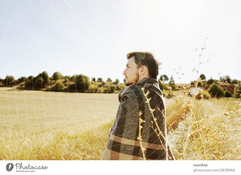 Side of a stand young man enjoying in calm the morning Lifestyle Happy Face Relaxation Calm Freedom Sunbathing Man Adults Sky Autumn Grass Lanes & trails Scarf