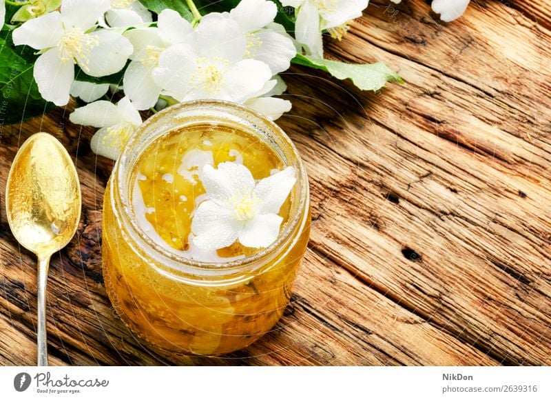 Delicious jasmine jam food sweet organic fresh healthy natural fruit dessert chubushnik glass delicious homemade jar summer jelly marmalade preserve spoon