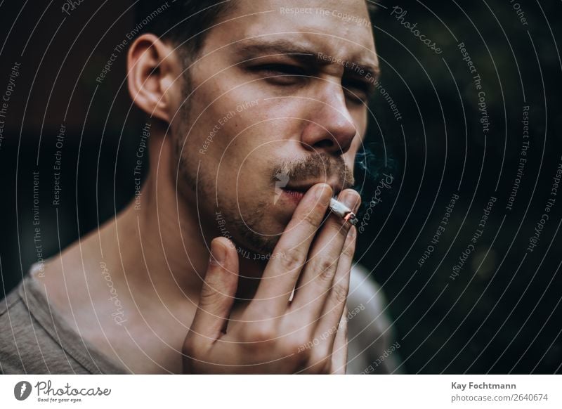 Young man pulling on a homemade cigarette Lifestyle Style Smoking Relaxation Masculine Youth (Young adults) Face 1 Human being 18 - 30 years Adults Brunette