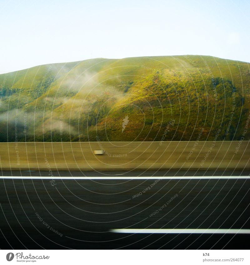 green hill Plant Sky Clouds Climate Beautiful weather Fog Motoring Street Highway Stone Driving Looking Large Natural Green Optimism Calm Speed Colour photo