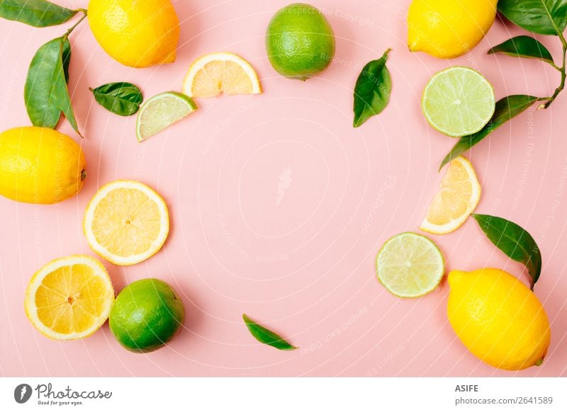 Lime and lemon frame on pink background Fruit Nutrition Beverage Lemonade Juice Summer Leaf Fresh Above Yellow Green Pink lime citrus drink food Mature colorful