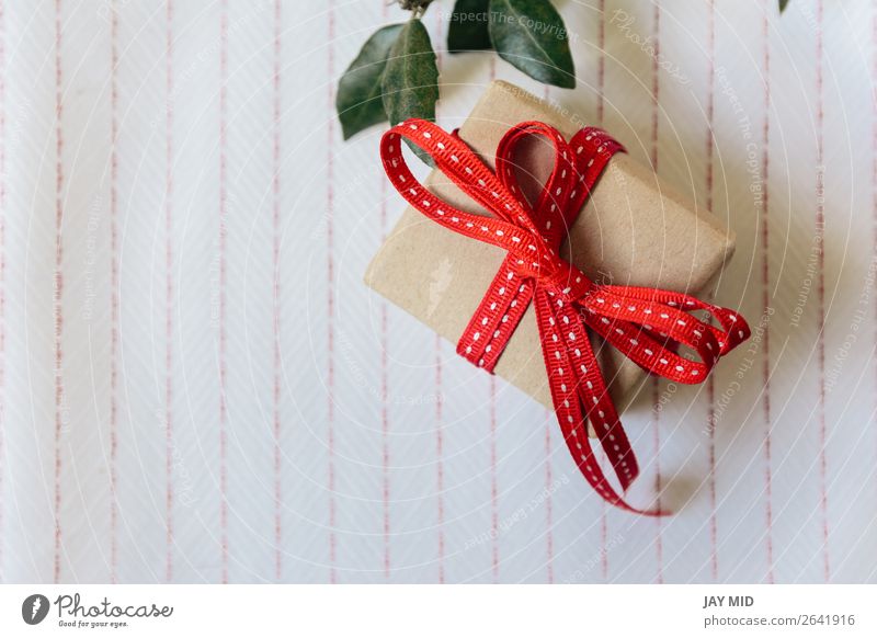 Gift box, wrapped in recycled paper and red bow Roll Shopping Elegant Mother's Day Birthday Cloth Tie Paper Package String Retro Red Surprise Tradition Wrap