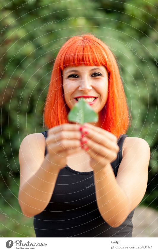 Red hair girl with a tree leaf Lifestyle Happy Beautiful Face Make-up Human being Woman Adults Nature Autumn Leaf Park Forest Fashion Smiling Happiness Colour