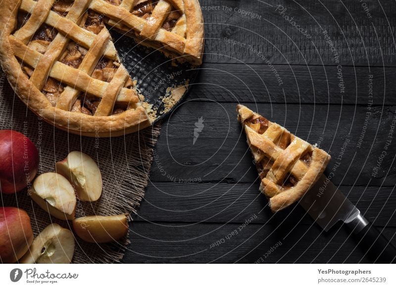 Kitchen table with an apple pie and a slice. Above view. Cake Dessert Candy Thanksgiving Christmas & Advent Delicious Retro Sweet Black Tradition