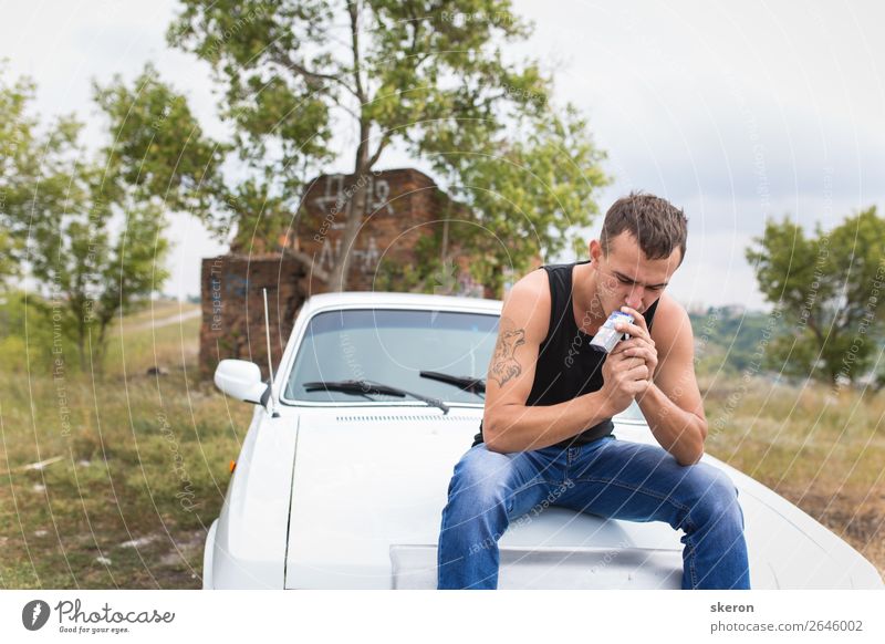 brutal guy sitting on the car and Smoking a cigarette Lifestyle Shopping Leisure and hobbies Playing Vacation & Travel Trip Adventure Far-off places Freedom