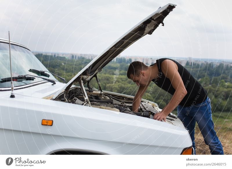 young guy repairing an old car Lifestyle Shopping Leisure and hobbies Playing Sports Fitness Sports Training Human being Masculine Young man