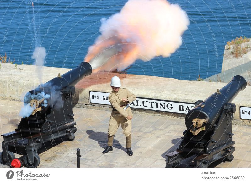 Saluting Battery Masculine 1 Human being 18 - 30 years Youth (Young adults) Adults 30 - 45 years Malta Europe Old town Protective clothing Helmet Uniform Cannon