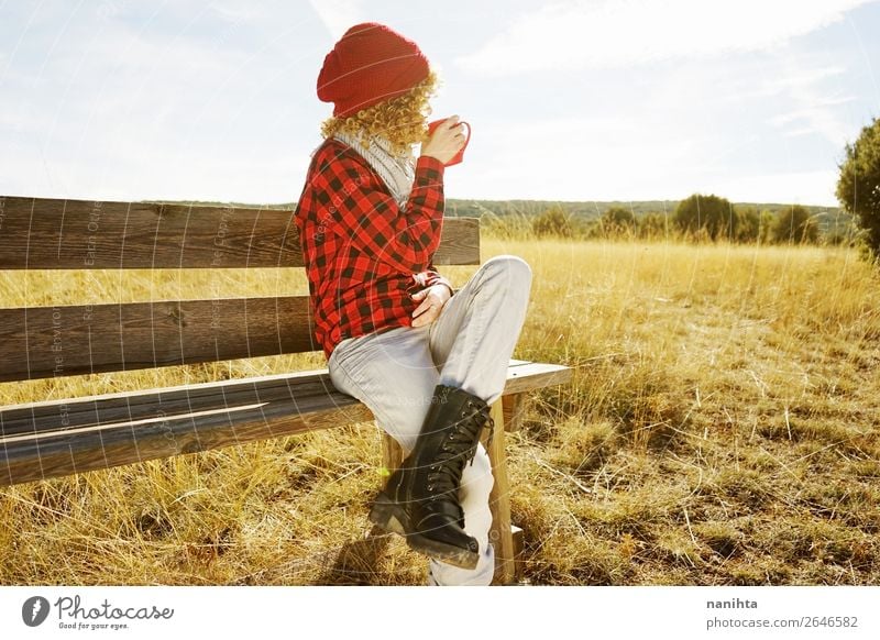 A young woman from behind drinking coffee outdoors Breakfast Coffee Tea Lifestyle Relaxation Calm Vacation & Travel Far-off places Freedom Sunbathing