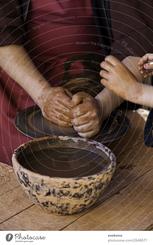 Hands of a potter forming clay Bowl Pot Handicraft Child Work and employment Craft (trade) Human being Woman Adults Fingers Art Culture Touch Make Dirty Wet