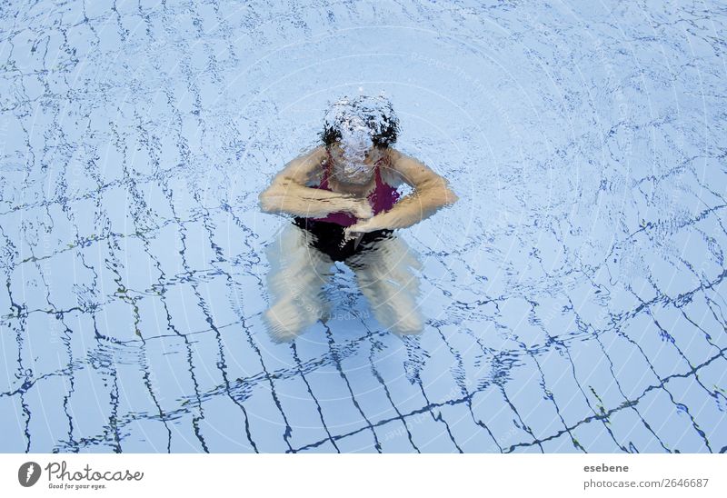 Young woman swimming in a pool in summer Lifestyle Beautiful Body Swimming pool Leisure and hobbies Sports Human being Woman Adults Man Arm Movement Fitness Wet