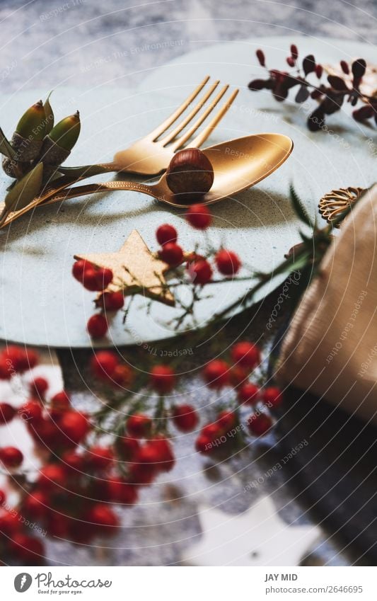 christmas table setting, golden cutlery and nandinas Dinner Plate Fork Spoon Winter Decoration Table Restaurant Thanksgiving Christmas & Advent New Year's Eve