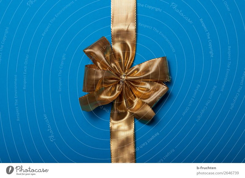 golden gift ribbon on blue background Feasts & Celebrations Packaging Decoration Bow Blue Gold Curiosity Surprise Expectation Mysterious Shopping Gift wrapping