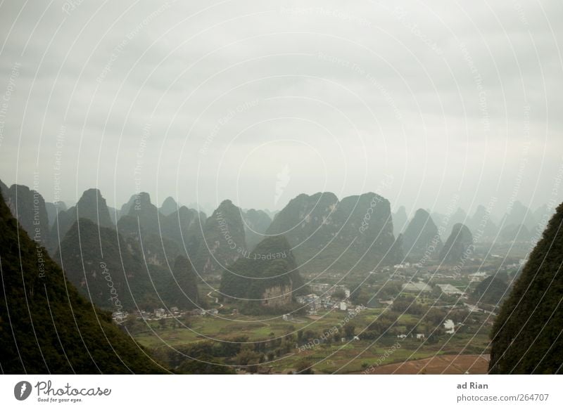 karst region Nature Landscape Clouds Hill Rock Mountain karst landscape Peak Yangshuo China Beautiful Colour photo Copy Space top Silhouette Bird's-eye view