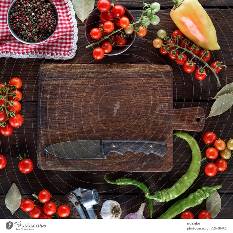 empty kitchen cutting and fresh red cherry tomatoes Vegetable Herbs and spices Nutrition Lunch Vegetarian diet Knives Table Kitchen Wood Eating Fresh Above