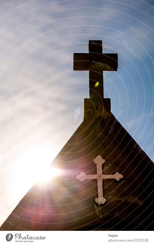 Cross of a Way of the Cross station on a pilgrim path in backlighting Crucifix Religion and faith christian Back-light Sun rays Catholic cross symbol Atonement