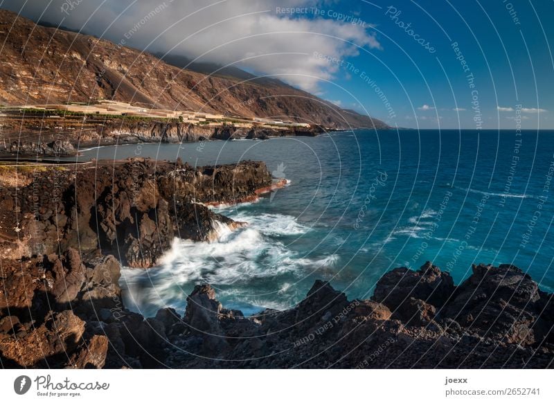 thousandth moments Nature Water Sky Clouds Beautiful weather Rock Mountain Waves Coast Ocean Island La Palma Sharp-edged Maritime Wild Blue Brown White Horizon