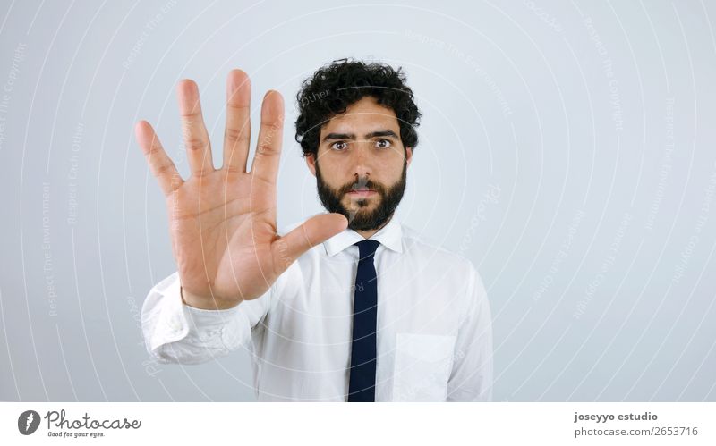 Man whit shirt and tie showing stop sign Adults Hand 30 - 45 years Shirt Tie Brunette Moustache Beard Strong Anger Might Brave Solidarity Tolerant Integrity