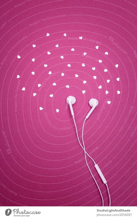 Earphones and hearts on bright magenta background Elegant Design Joy Happy Entertainment Music Technology Plastic Heart Glittering Listening Love Simple Bright