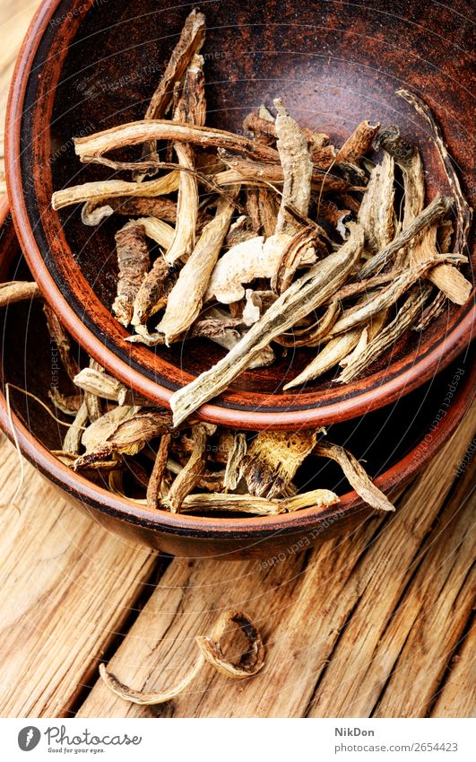 Healing herbs and herbal tea beverage healing dry healthy drink cup medicine immunity mug natural leaf plant wooden background savory wooden table green glass