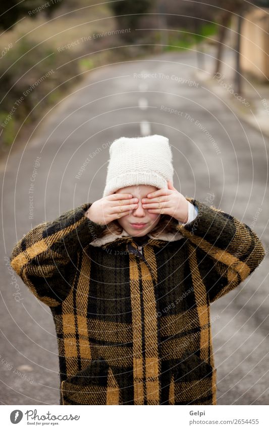 Beautiful little girl with wool hat covering her eyes Joy Face Playing Winter Child Human being Toddler Woman Adults Family & Relations Infancy Autumn Warmth