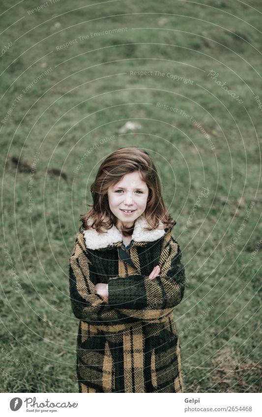 Beautiful girl with coat Joy Happy Face Winter Garden Child Human being Toddler Woman Adults Family & Relations Infancy Nature Autumn Warmth Grass Park Fashion