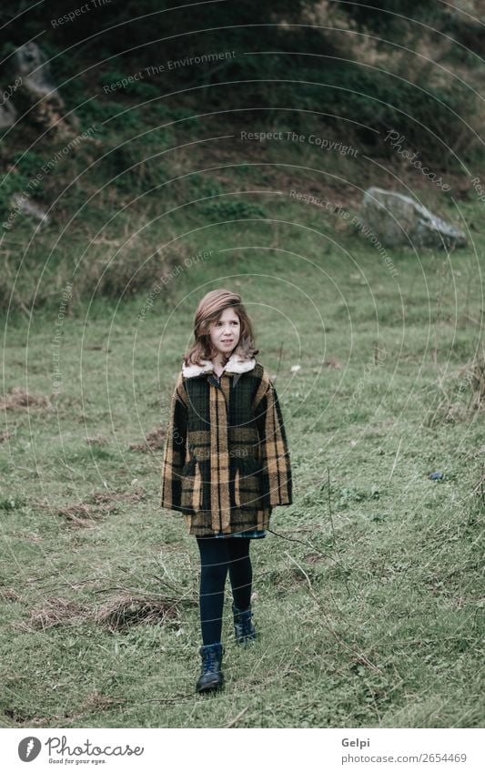 Beautiful girl with coat Joy Happy Face Winter Garden Child Human being Toddler Woman Adults Family & Relations Infancy Nature Autumn Warmth Grass Park Fashion