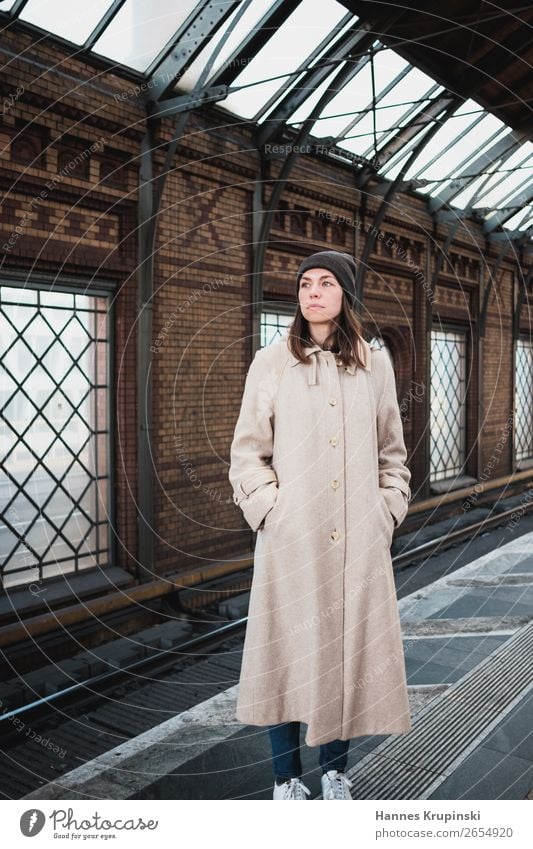 Waiting Train station Coat Woman by oneself Commuter trains Commuter train station S-Bahn station Station Berlin Cap