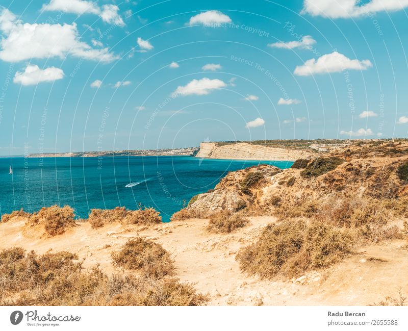 Ocean Landscape With Rocks And Cliffs At Lagos Bay Coast In Algarve, Portugal Nature Hole Cave Beach Stone Arch Window Vantage point Beautiful Vacation & Travel