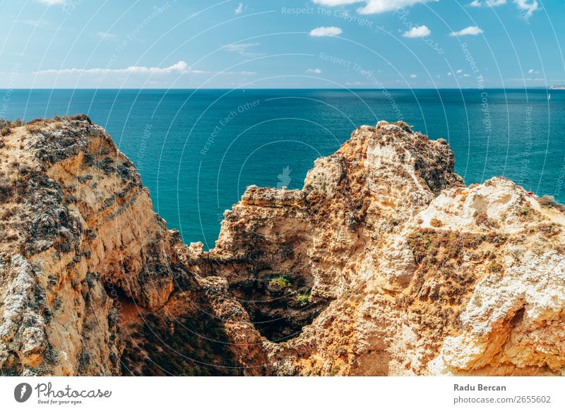 Ocean Landscape With Rocks And Cliffs At Lagos Bay Coast In Algarve, Portugal Nature Hole Cave Beach Stone Arch Window Vantage point Beautiful Vacation & Travel