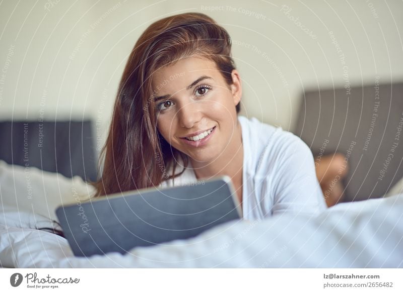 Pretty young woman with tablet in bed Shopping Happy Beautiful Bedroom Business Computer Technology Internet Woman Adults 1 Human being 18 - 30 years