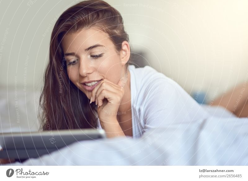 Pretty young woman with tablet in bed Shopping Happy Beautiful Bedroom Business Computer Technology Internet Woman Adults 1 Human being 18 - 30 years