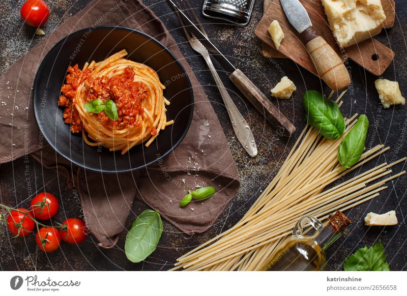 Spaghetti pasta with bolognese sauce Meat Cheese Herbs and spices Lunch Dinner Plate Fork Wood Bright Tradition Basil Beef Bolognese Cooking Dish food Italian