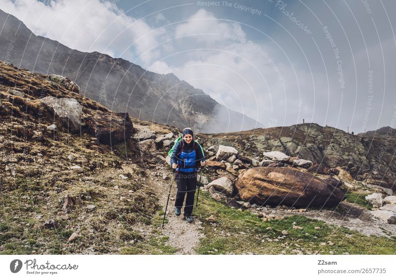 Young woman descending from Timmelsjoch | E5 Vacation & Travel Adventure Hiking Youth (Young adults) Nature Landscape Clouds Beautiful weather Alps Mountain