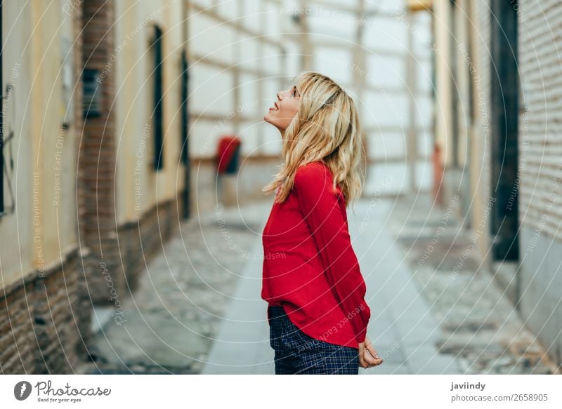 Happy young blond woman walking down the street. Lifestyle Style Beautiful Hair and hairstyles Human being Young woman Youth (Young adults) Woman Adults 1